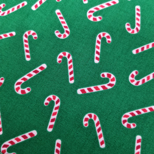 Candy canes on green