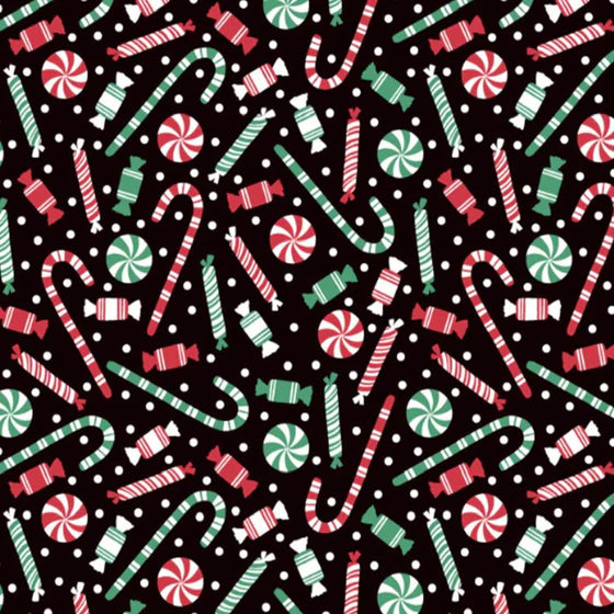 Candy canes and Christmas sweets on black