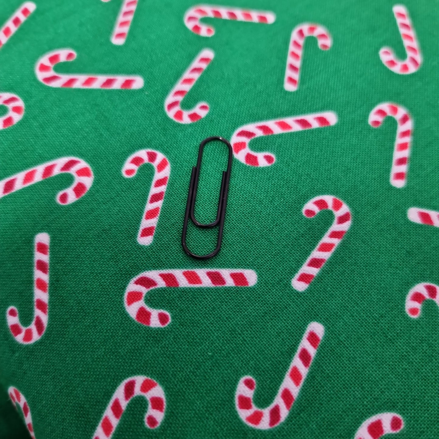 Candy canes on green